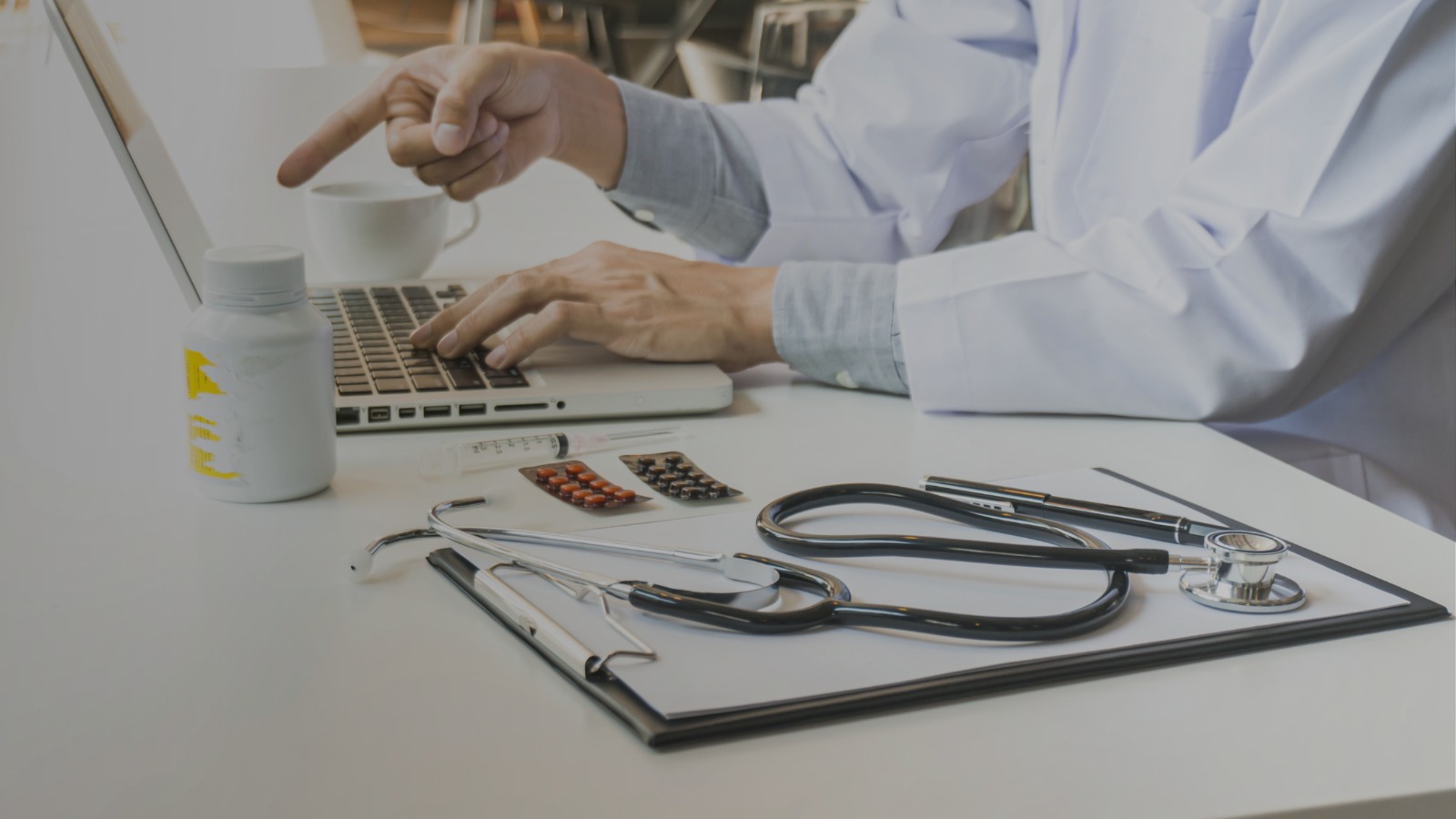 Pharmacist assisting customer at modern pharmacy counter