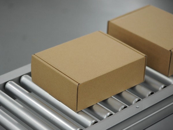 Pharmacist assisting customer at modern pharmacy counter